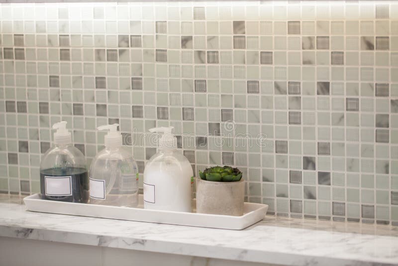 Liquid soap bottle with tile background Bathroom accessories.