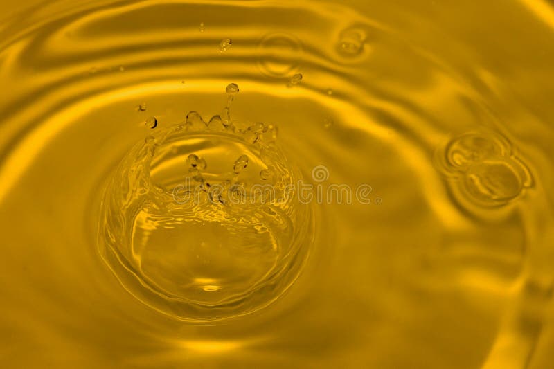 Golden liquid close-up. Golden liquid close-up