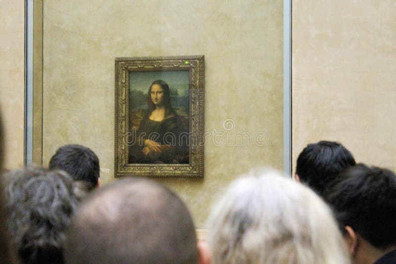 Paris France -04/06/2018 : Leonardo DaVinci`s `Mona Lisa` at the Louvre Museum May 13 2015 in Paris France. The painting is one of the world`s most famous. Paris France -04/06/2018 : Leonardo DaVinci`s `Mona Lisa` at the Louvre Museum May 13 2015 in Paris France. The painting is one of the world`s most famous.