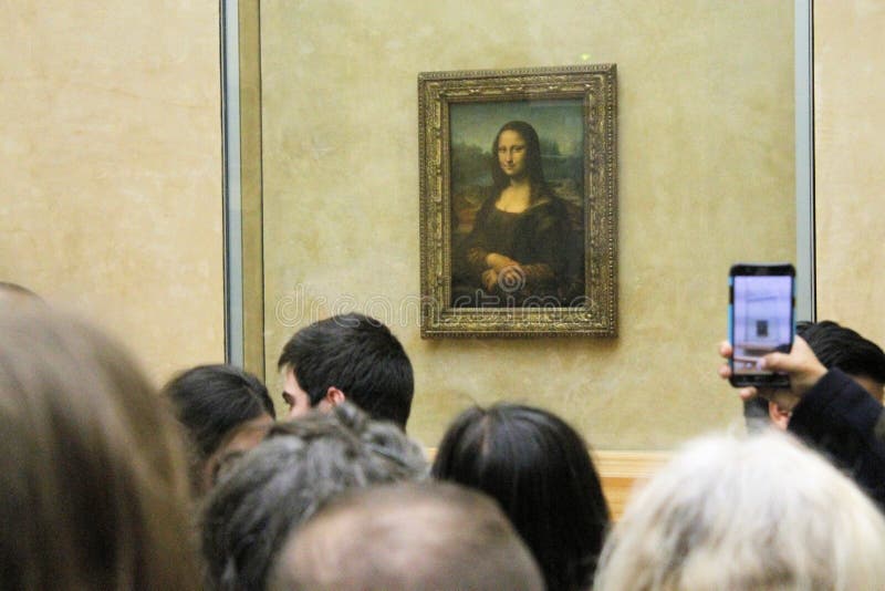 Paris France -04/06/2018 : Leonardo DaVinci`s `Mona Lisa` at the Louvre Museum May 13 2015 in Paris France. The painting is one of the world`s most famous. Paris France -04/06/2018 : Leonardo DaVinci`s `Mona Lisa` at the Louvre Museum May 13 2015 in Paris France. The painting is one of the world`s most famous.