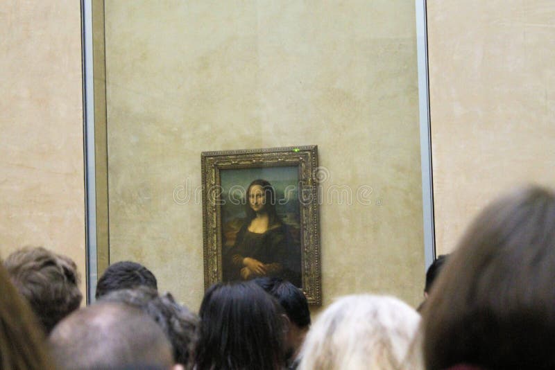 Paris France -04/06/2018 : Leonardo DaVinci`s `Mona Lisa` at the Louvre Museum May 13 2015 in Paris France. The painting is one of the world`s most famous. Paris France -04/06/2018 : Leonardo DaVinci`s `Mona Lisa` at the Louvre Museum May 13 2015 in Paris France. The painting is one of the world`s most famous.