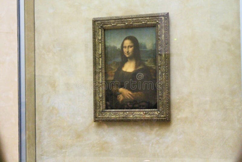 Paris France -04/06/2018 : Leonardo DaVinci`s `Mona Lisa` at the Louvre Museum May 13 2015 in Paris France. The painting is one of the world`s most famous. Paris France -04/06/2018 : Leonardo DaVinci`s `Mona Lisa` at the Louvre Museum May 13 2015 in Paris France. The painting is one of the world`s most famous.