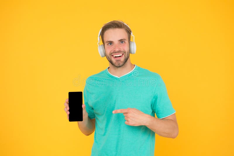 Listen for free. Enjoy music concept. Best music apps that deserve listen. Guy modern user mobile application. Get music royalty free stock photo Listen for free. Enjoy music concept. Best music apps that deserve listen. Guy modern user mobile application. Get music royalty free stock photo