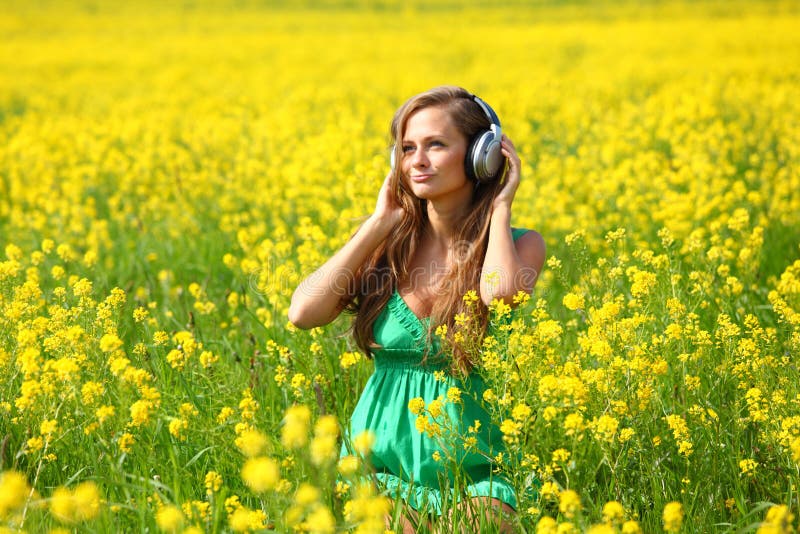 Listening To Music in Flowers Stock Photo Image of flowers, bright