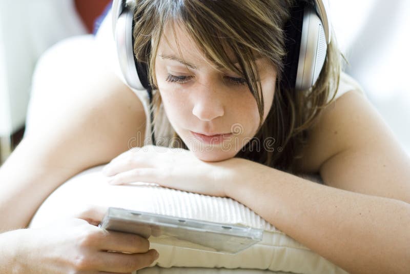 Listening to Music stock image. Image of headphones, reading - 8662041