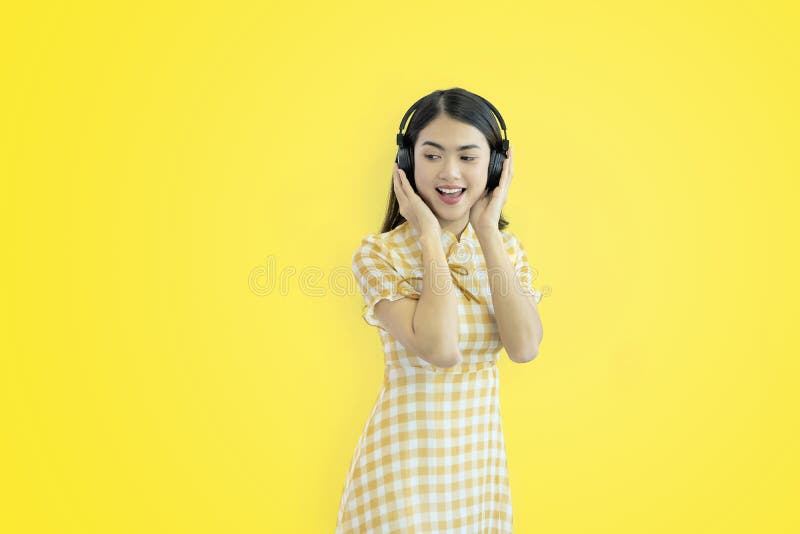 She is listening to music happily by Headphone bluetooth Wireless