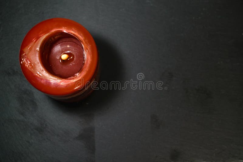 Lit Red Candle on a Rough Dark Surface, Top View Stock Photo Image of