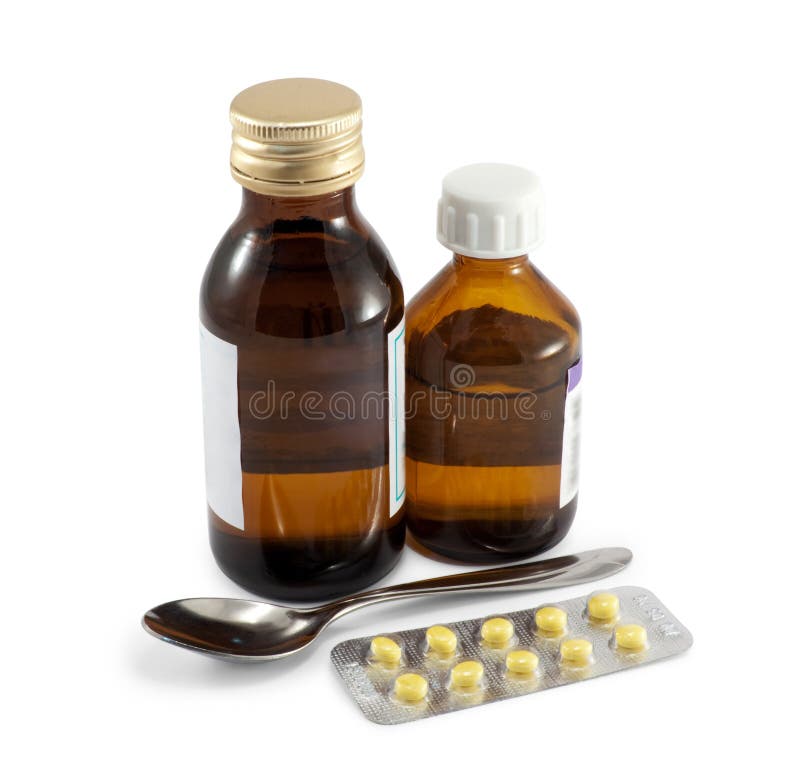 Liten medicinflaska med drogen och skivan av minnestavlan royaltyfria bilder Liten medicinflaska med drogen och skivan av minnestavlan royaltyfria bilder