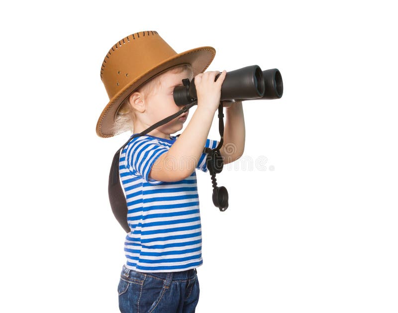 Liten rolig flicka som ser till och med kikare arkivbilder Liten rolig flicka som ser till och med kikare arkivbilder