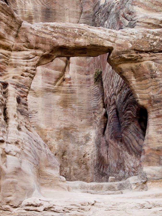 Small tomb in Petra (Street of Facades part) - Nabataeans capital city (Al Khazneh) , Jordan. Made by digging a holes in the rocks. Roman Empire period. Small tomb in Petra (Street of Facades part) - Nabataeans capital city (Al Khazneh) , Jordan. Made by digging a holes in the rocks. Roman Empire period.