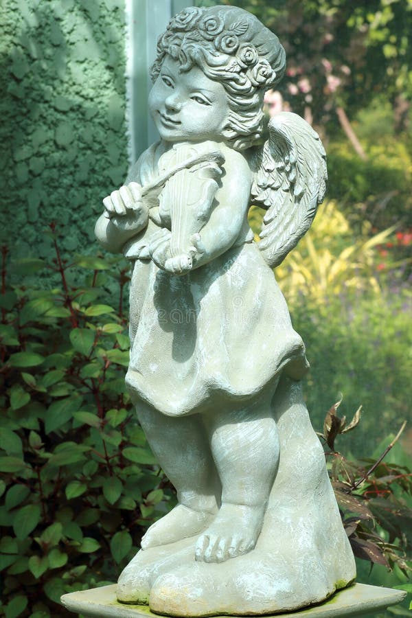 Little Angel Statue in Flower Garden Stock Image Image of statue