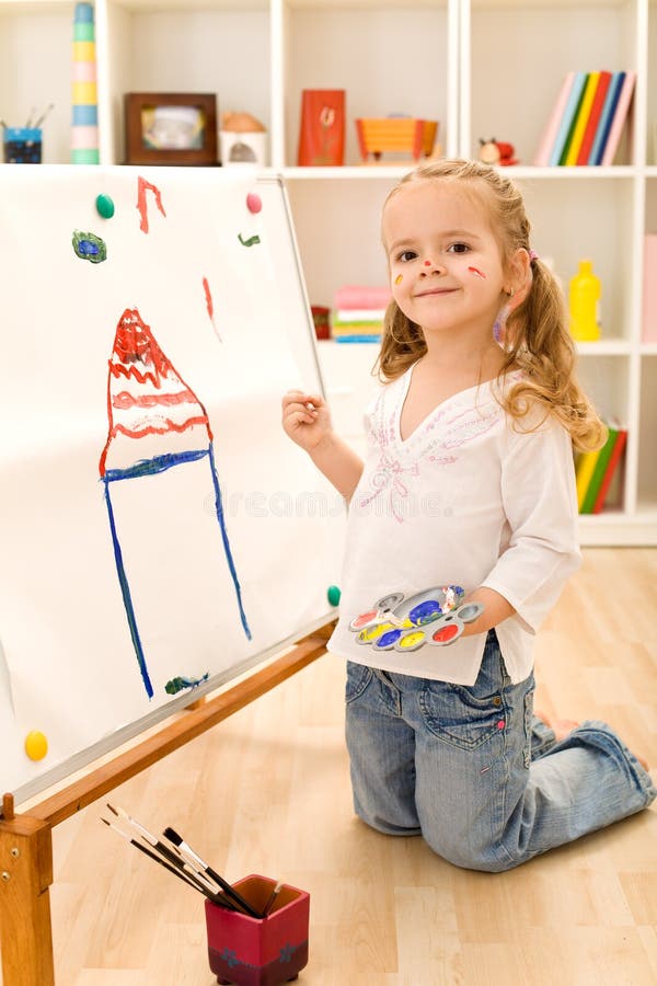 Little artist girl painting her dream house