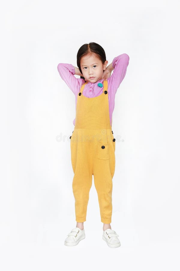 Little Asian Child Girl Wearing a Yellow Dungarees Isolated on White ...