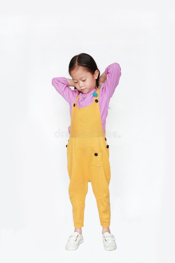 Little Asian Child Girl Wearing a Yellow Dungarees Isolated on White ...