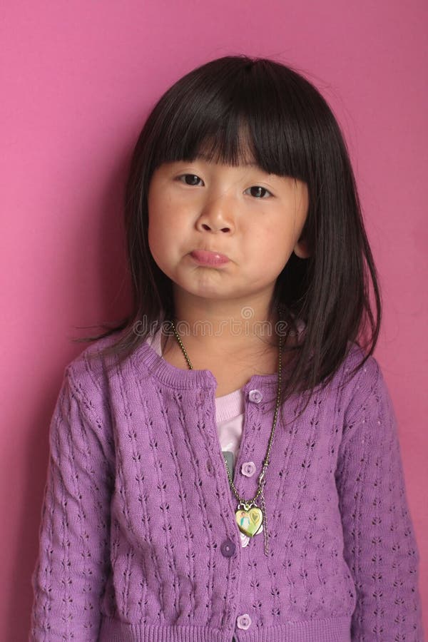 little asian chinese girl with sad face