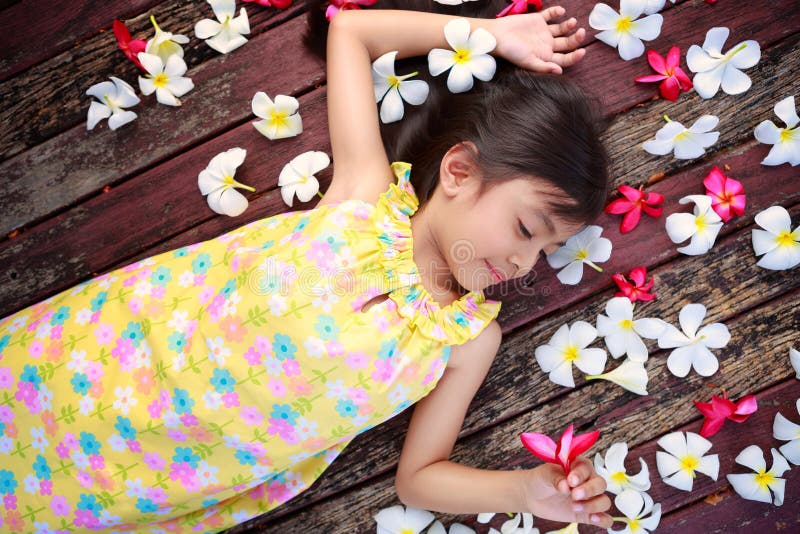 Little asian girl laying on the floor