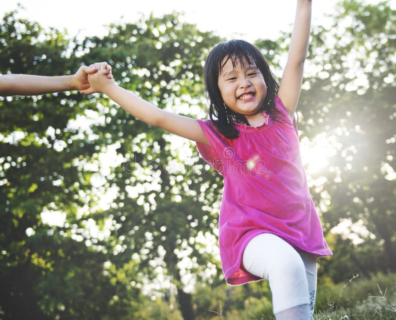 Little Asian girl playing in the park royalty free stock photography Little Asian girl playing in the park royalty free stock photography
