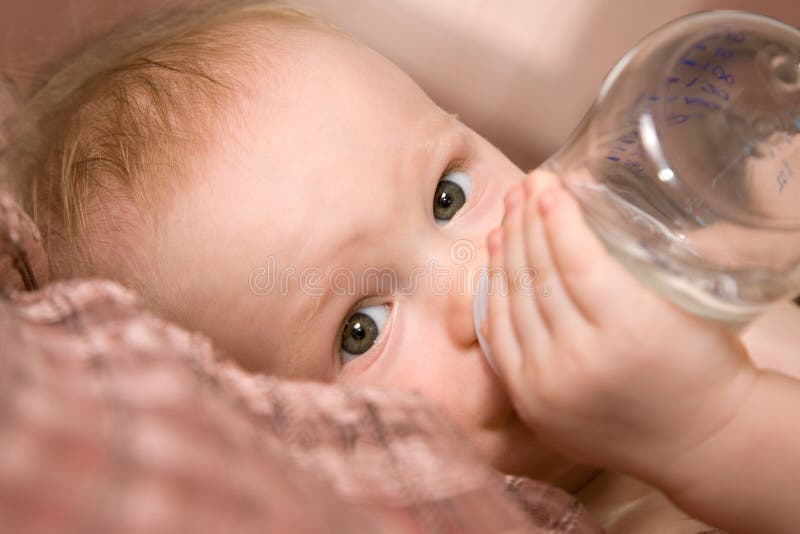 Little baby with bottle