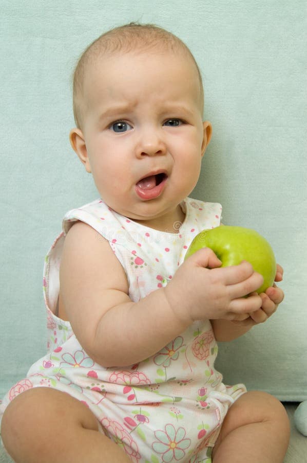 Little baby eating apple stock photo. Image of cute, hand 90946424