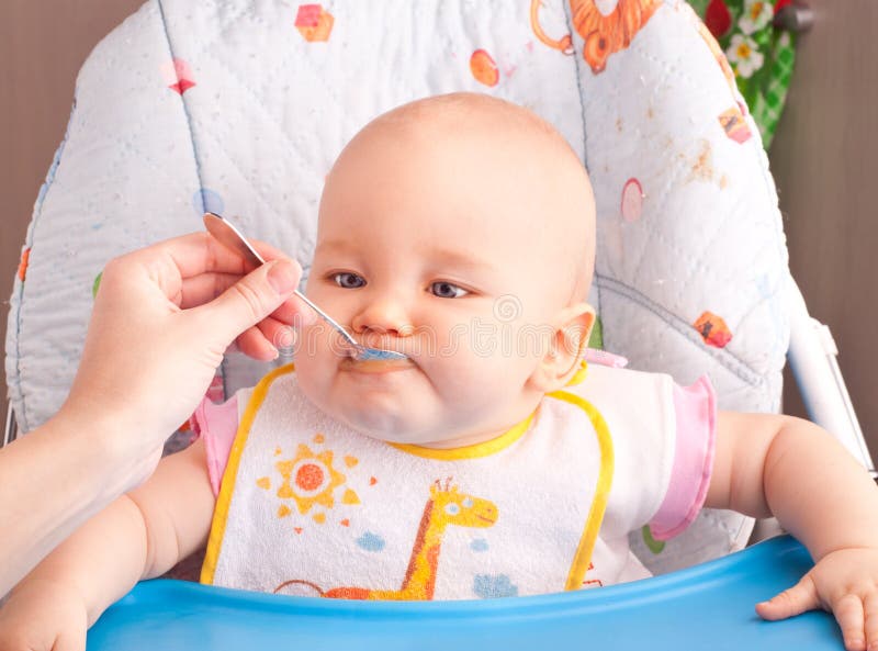 Little Baby Feeding with a Spoon Stock Photo Image of care, little