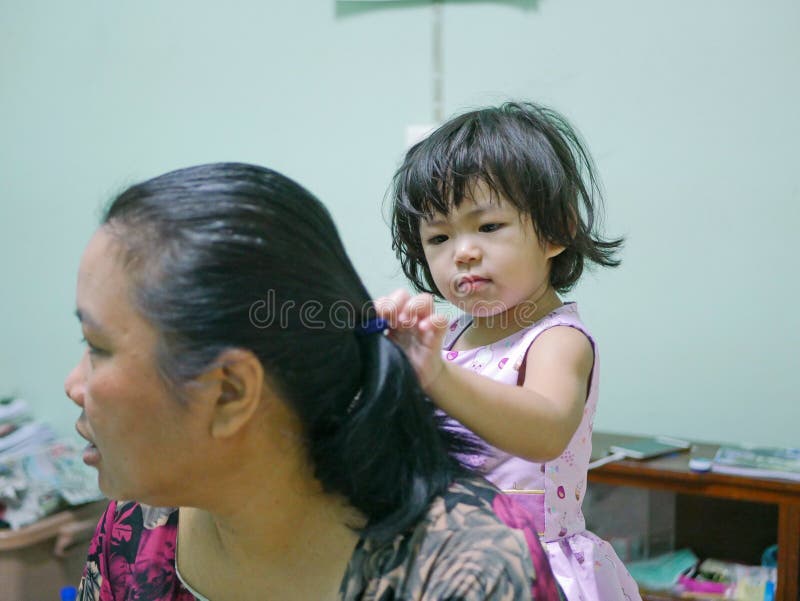 Little Baby Girl, 2 Years Old, Enjoys Playing / Pretending To Do Her Auntie`s Hairs at Home Stock Image - Image of pretending, aunty: 208578511 Little Baby Girl, 2 Years Old, Enjoys Playing / Pretending To Do Her Auntie`s Hairs at Home Stock Image - Image of pretending, aunty: 208578511