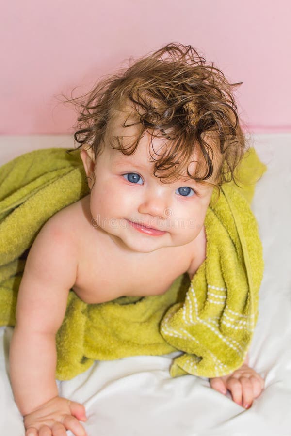 Little Baby in a Green Towel after Bathing. Stock Photo Image of