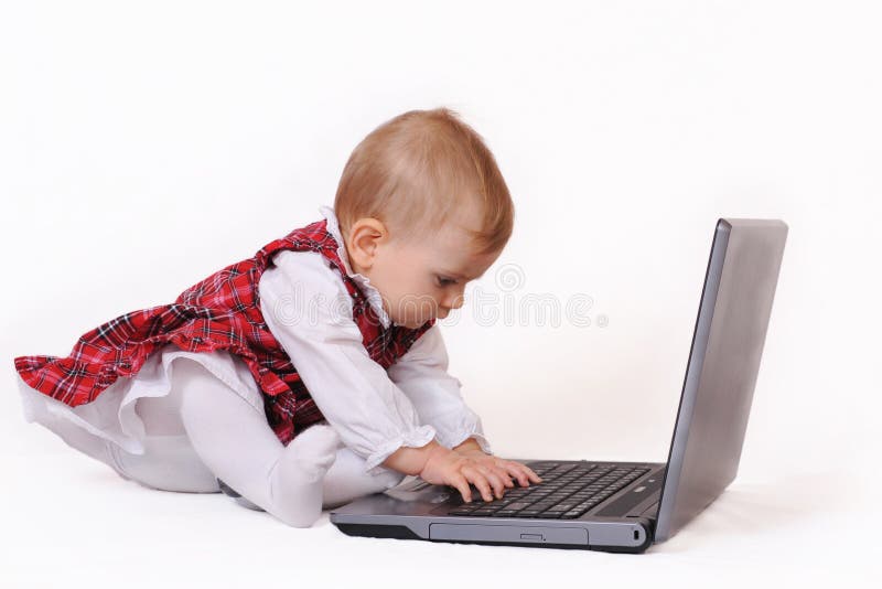 Little baby and laptop royalty free stock images