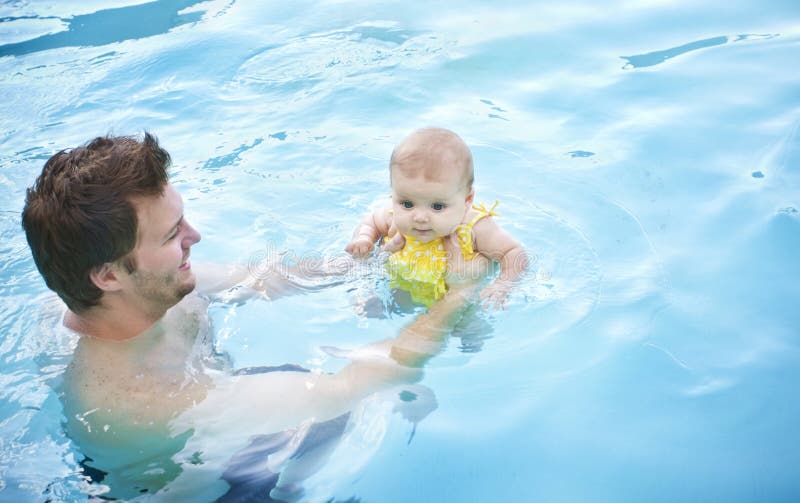 Little baby's first swim royalty free stock photo Little baby's first swim royalty free stock photo