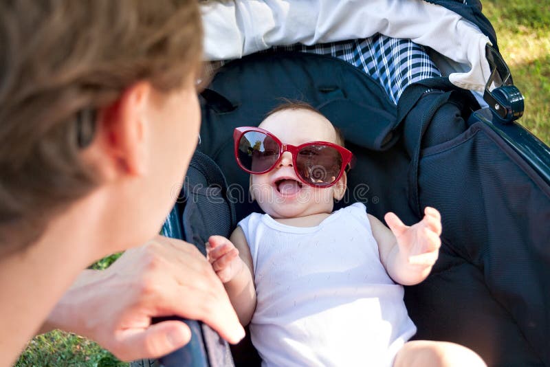 Little Baby In A Stroller In Funny Big Sunglasses Funny Baby Smiling