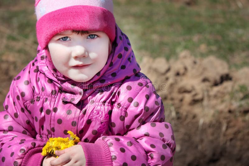 Little beautiful girl holds yellow flowers royalty free stock photography Little beautiful girl holds yellow flowers royalty free stock photography