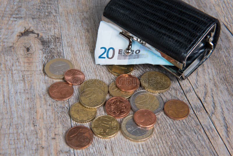 Little black coin purse with some coins