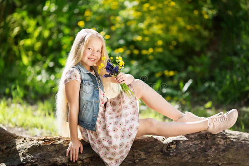 Little Blonde Girl with Bouquet of Flowers Stock Photo - Image of park ...