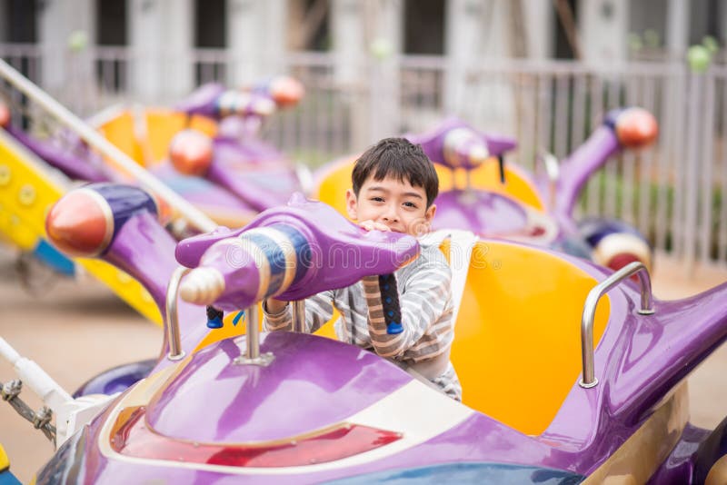 Little boy in amusement park outdoor royalty free stock photos Little boy in amusement park outdoor royalty free stock photos