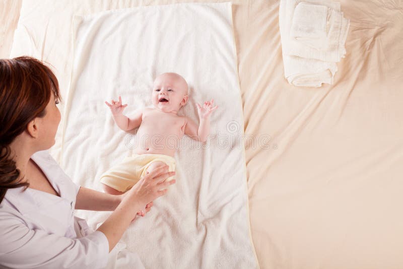 The Little Boy Baby Mother Doing Massage Hands and Legs Stock Im wife image The Little Boy Baby Mother Doing Massage Hands and Legs Stock Im Porn Photo Hd