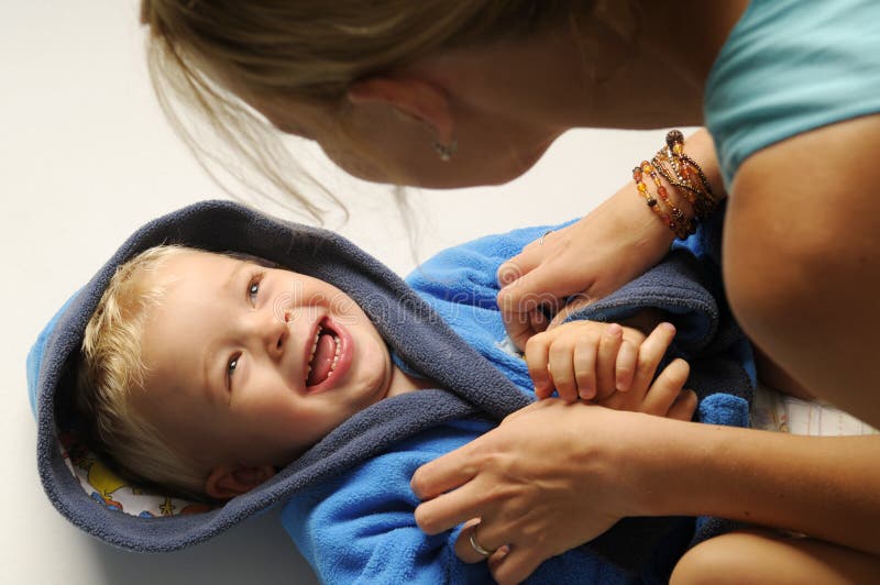 Little boy in bath robe stock photo. Image of mother 16928834