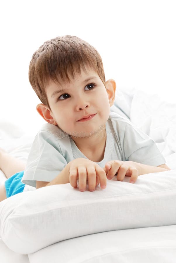 The little boy on a bed stock photo. Image of tranquil 10449136