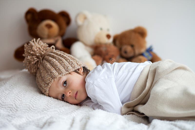 Little Boy In Bed With Teddy Bears Around Stock Image Image 37063559