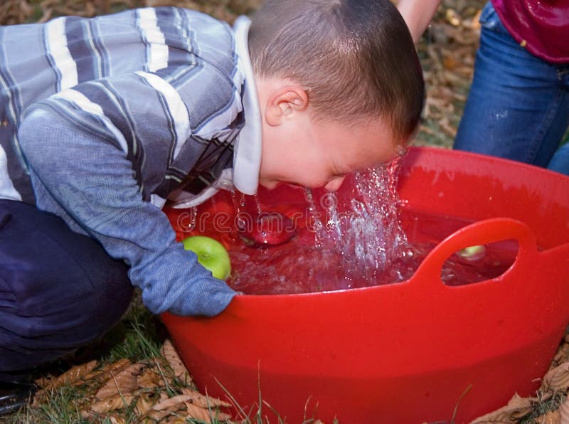 Little Boy Bobbing For Apples