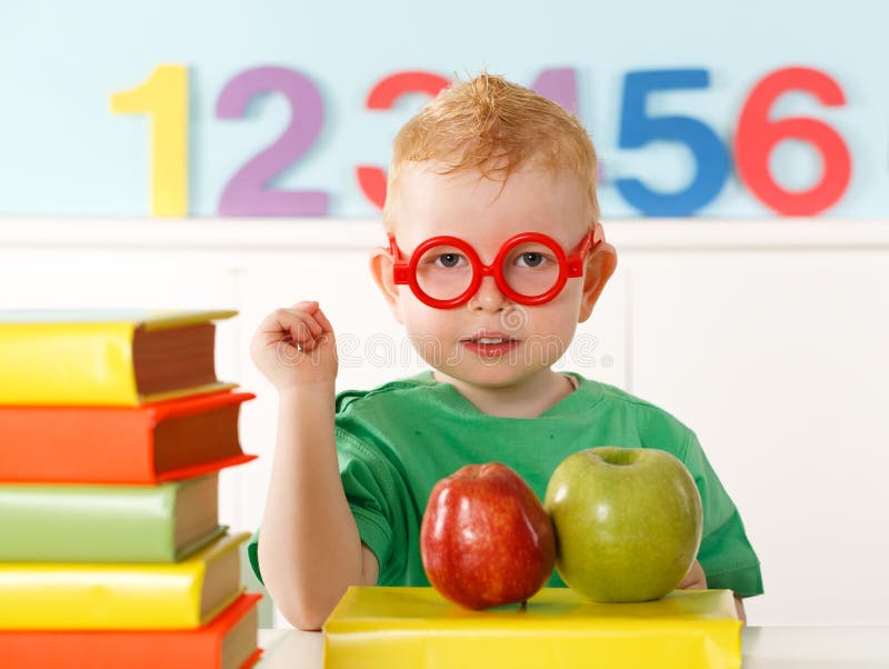 Little genius with books for reading