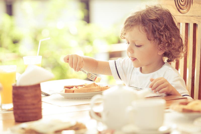 Little boy at breakfast