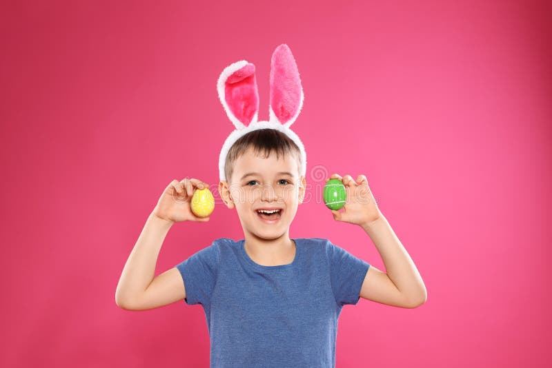 Little Boy In Bunny Ears Headband Holding Easter Eggs Stock Photo ...