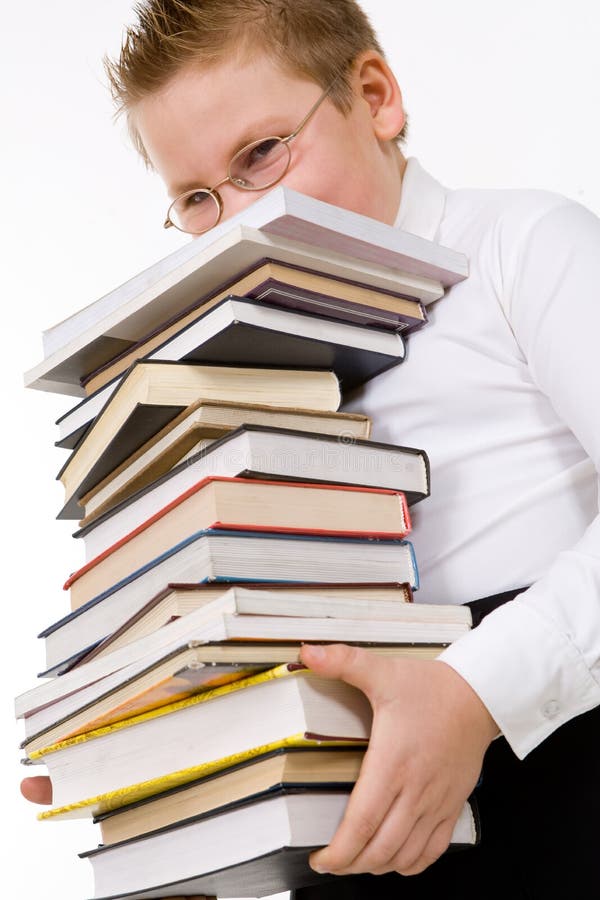 Little boy carrying books stack