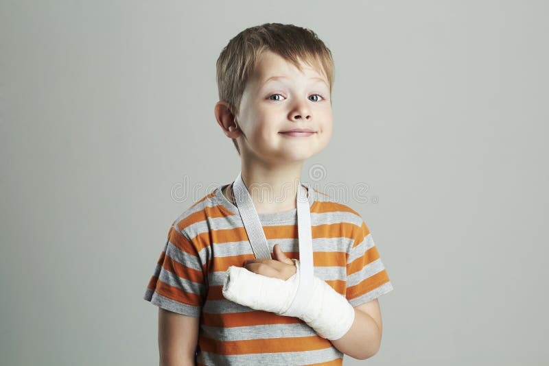 Little boy in a cast.child with a broken arm. funny kid after accident stock photography Little boy in a cast.child with a broken arm. funny kid after accident stock photography