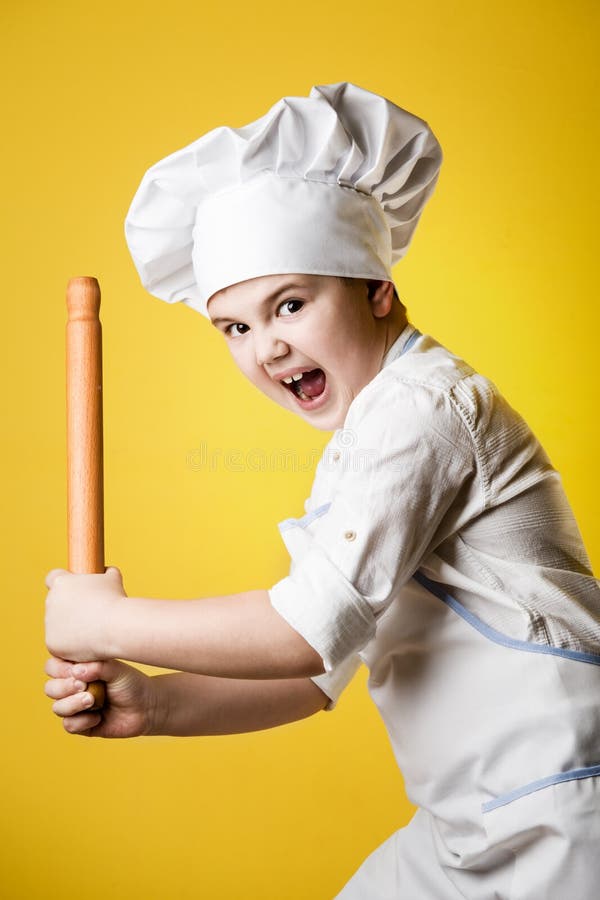 Little boy chef in uniform stock photo. Image of cheerful - 37521192