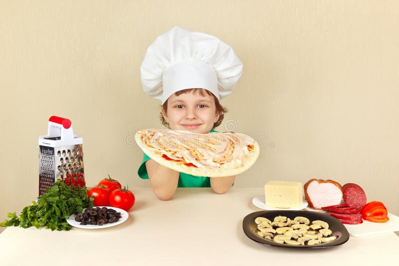 Little Boy In Chefs Hat Smeared With Sauce On Pizza Crust
