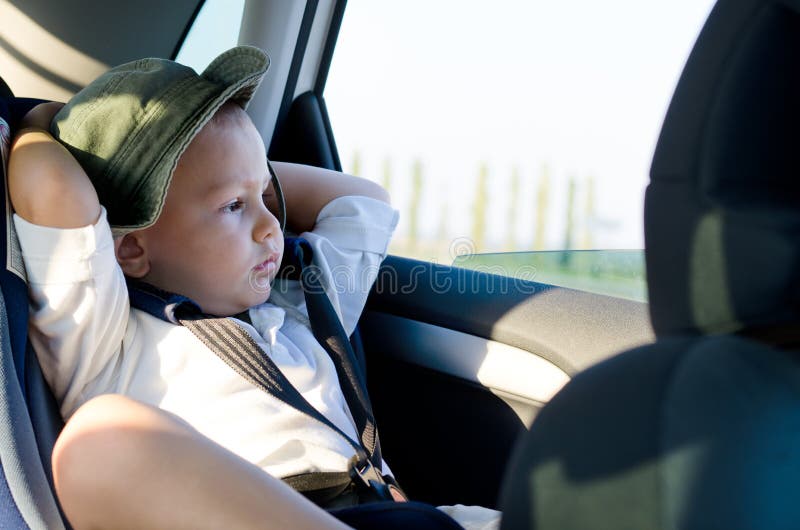 Little boy in a child safety seat stock photo Little boy in a child safety seat stock photo