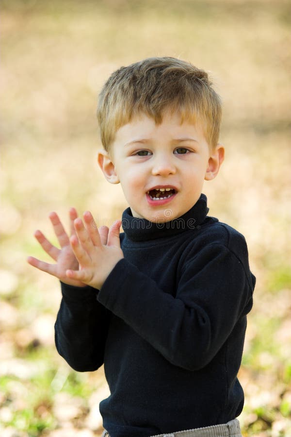 A little boy clapping