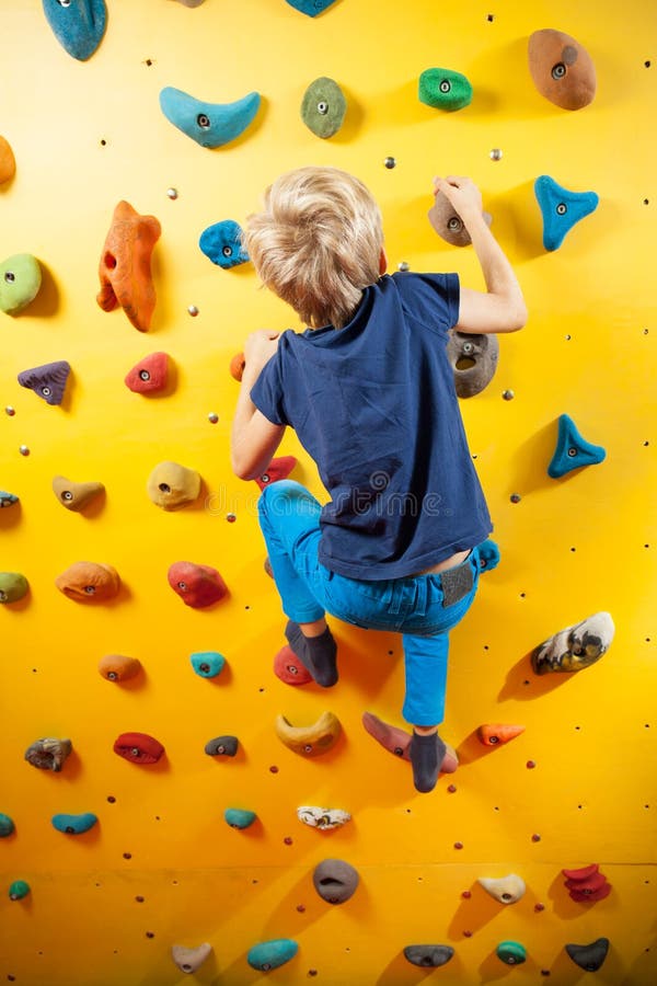 Little boy on the climbing wall