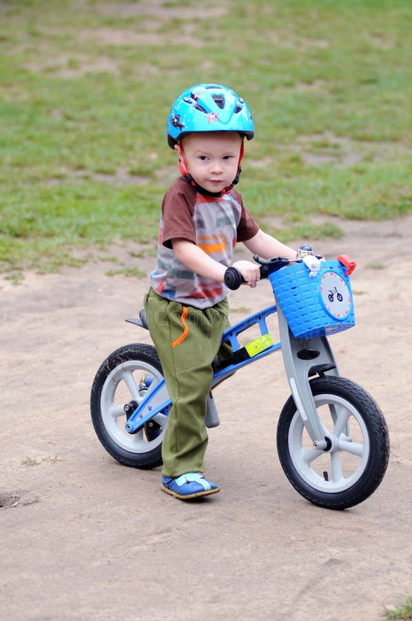A Little Boy Cycling on His First Bike Stock Image Image of little