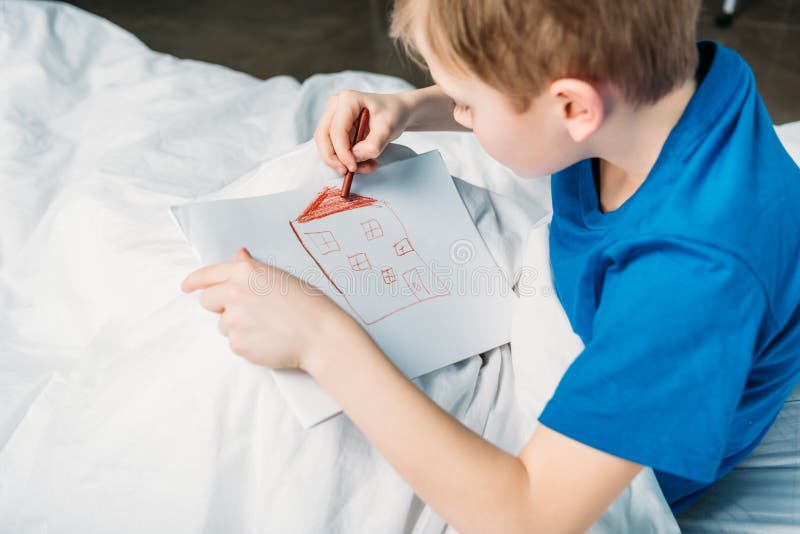 Little Boy Drawing Picture while Lying in Hospital Bed Stock Photo Image of people, medicine